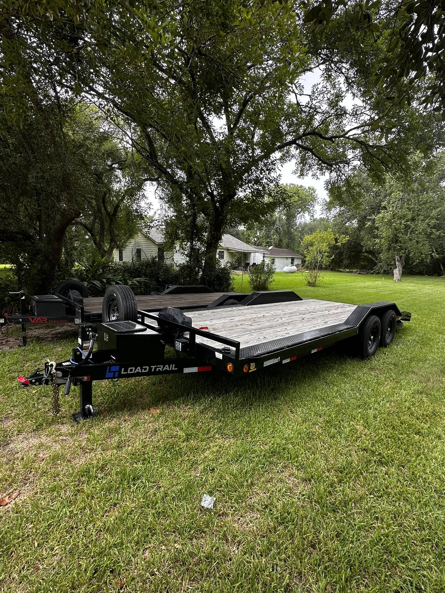 Load Trail equipment trailer on green grass
